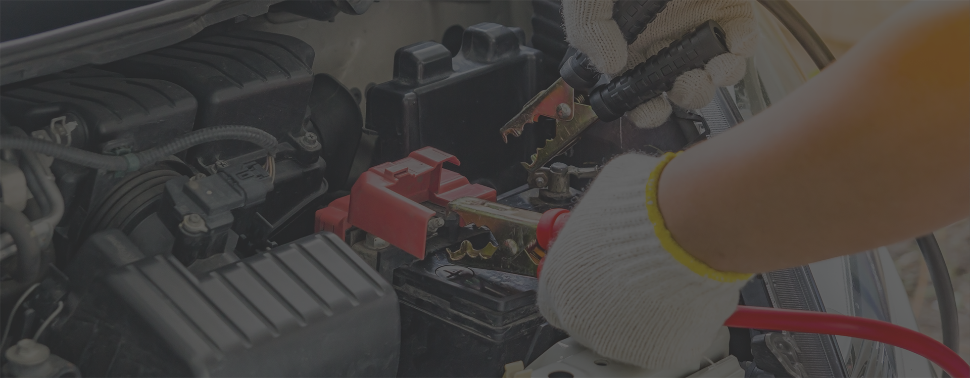 Image shows a car batter having jump leads attached. Image depicts preparing for winter with PowerStart Jump Packs