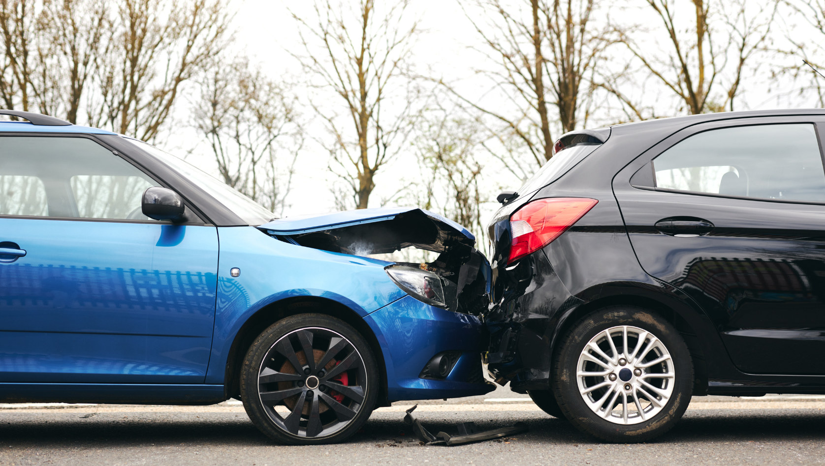 Image shows a car that has crashed into the back of another car. Image depicts accident recovery